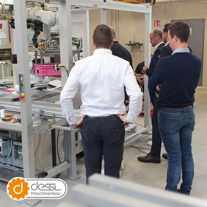 The guests take a look at the latest model of the Dessl Collector under construction.